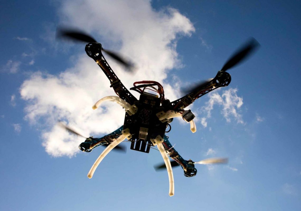 drone-in-flight-with-cloudy-sky-PTCUKNJ-scaled.jpg